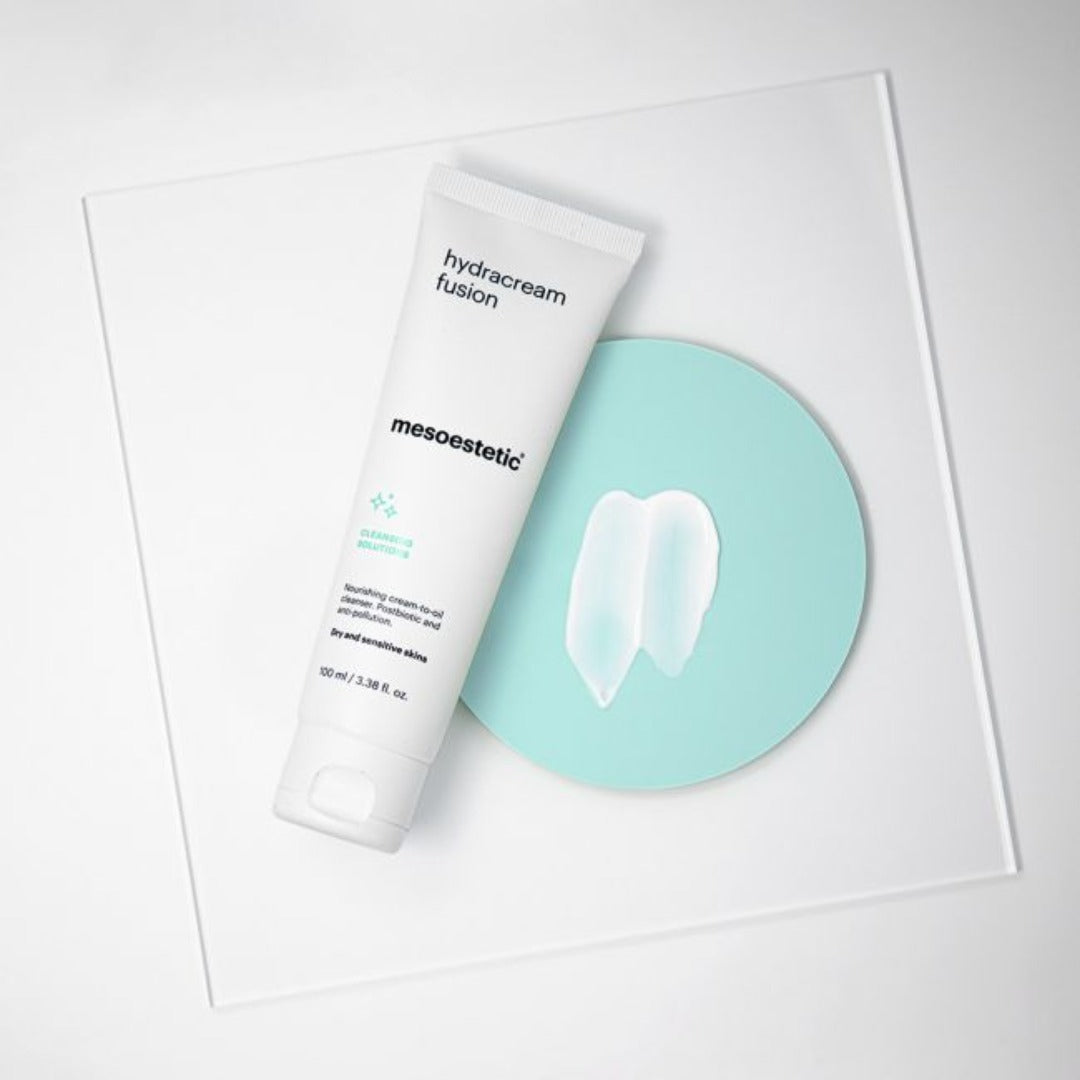 mesoestetic Hydracream Fusion tube on a green circle with its cream poured in the centre