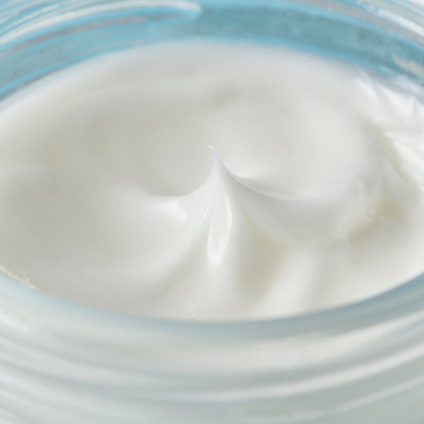 Hyaluronic acid night cream smooth texture inside the jar close up